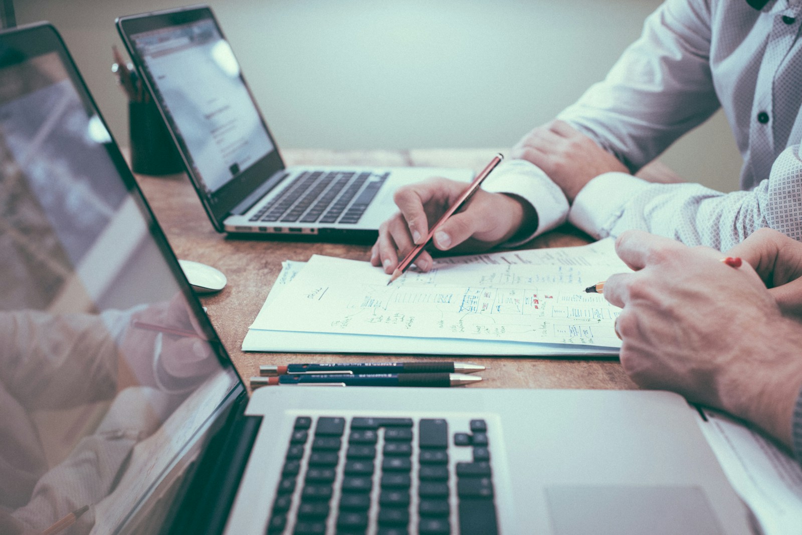 Planning desk with media calendar, channel notes, and strategy documents